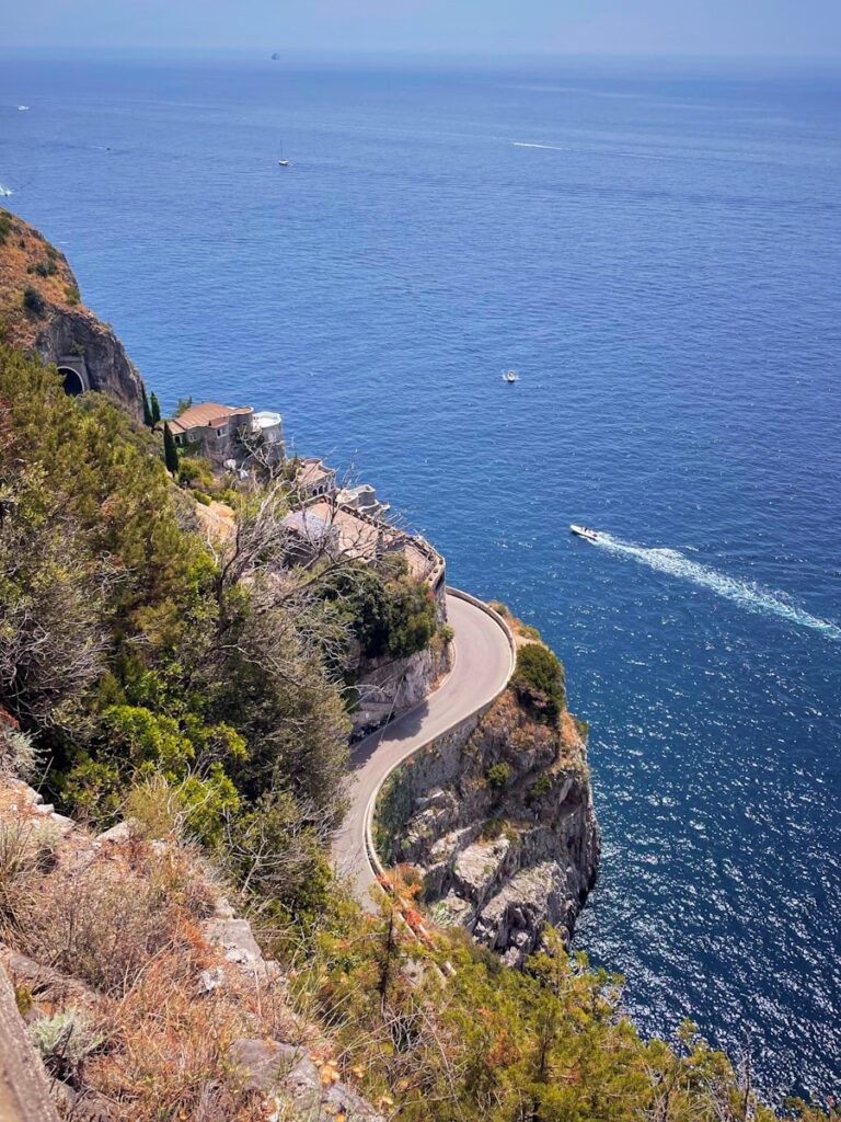 getting around the Amalfi Coast green trees on cliff by the sea during daytime