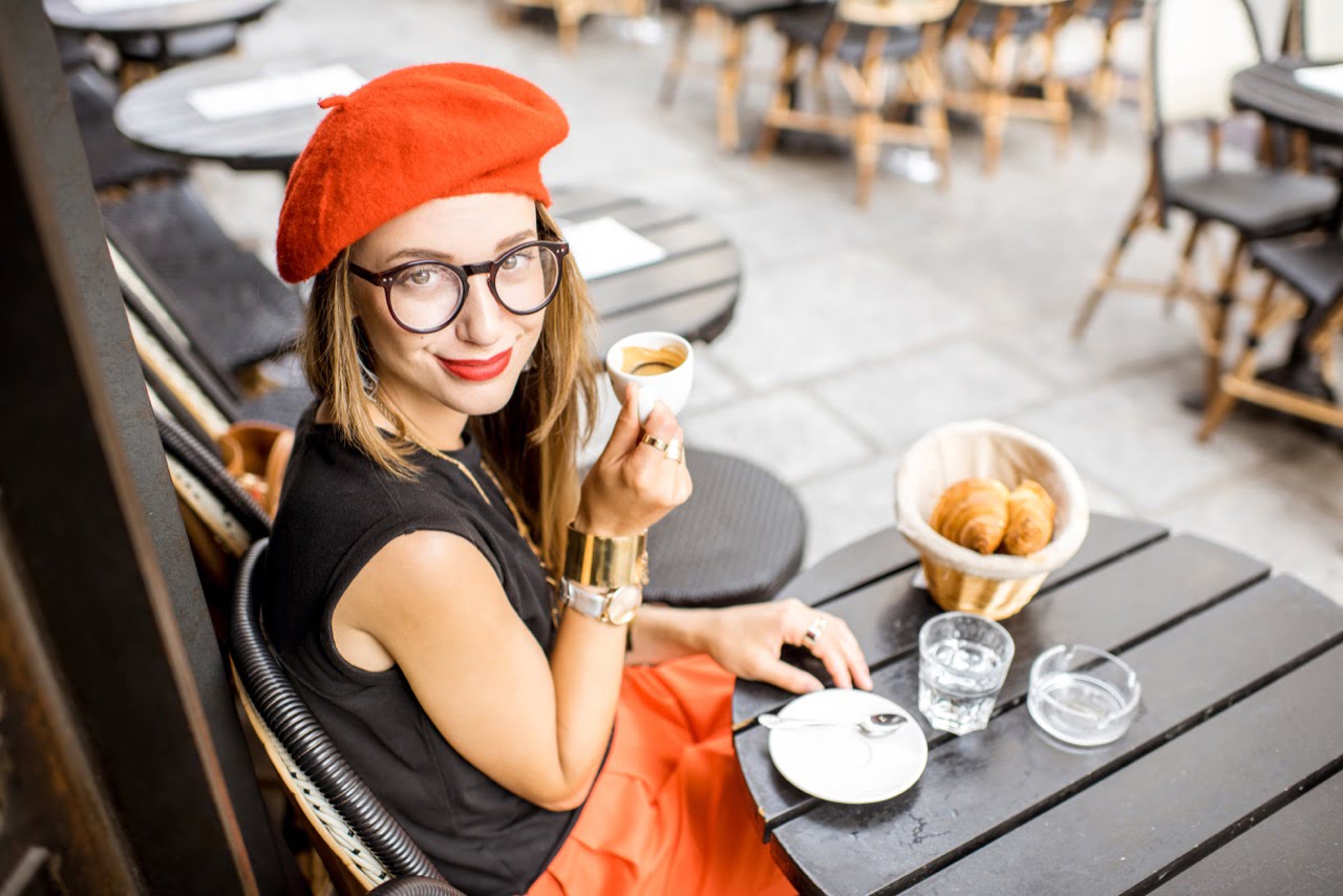 Woman having breakfast espresso