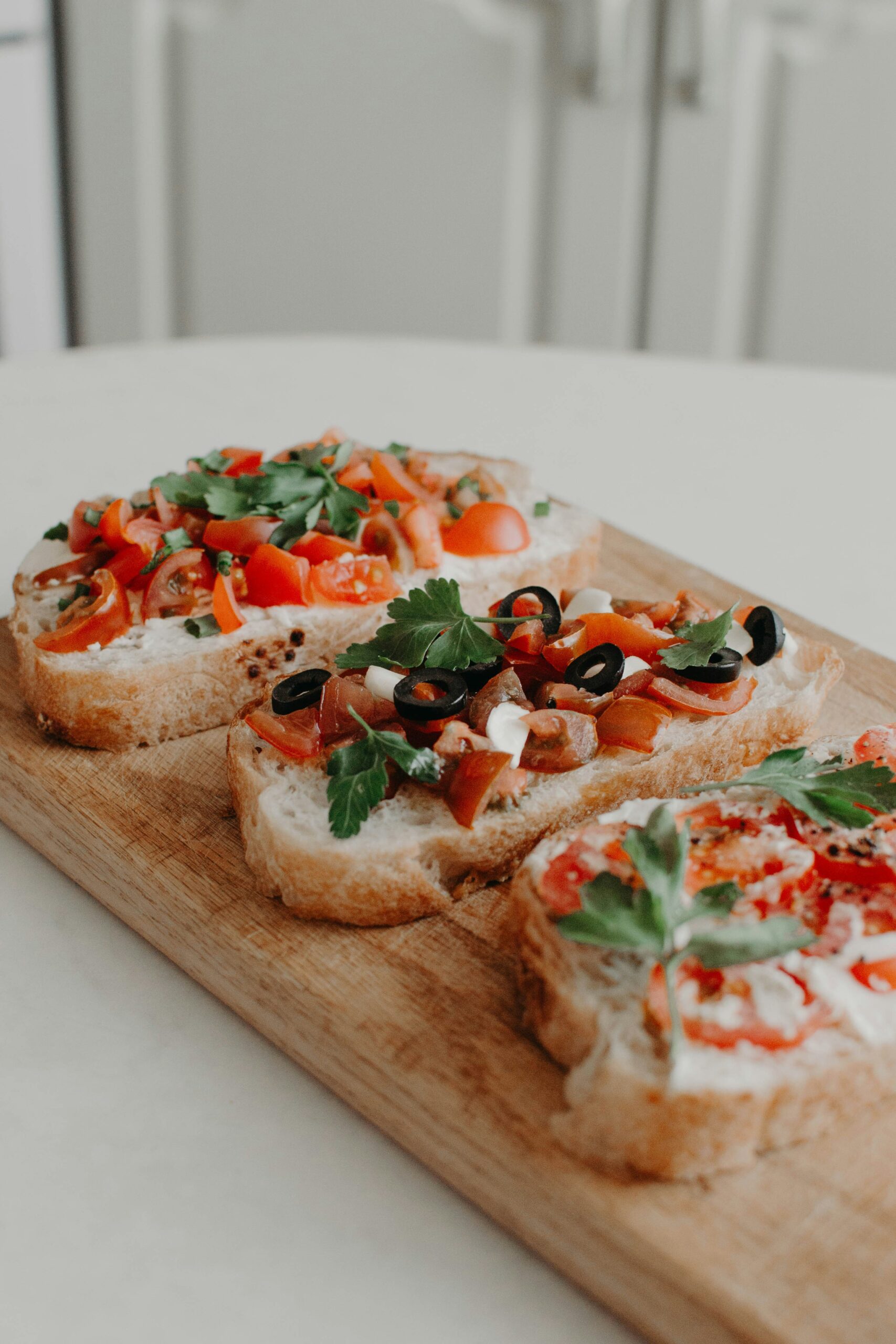 Italian Bucato with tomato olives, mozzarella garlic olive oil placed on wooden tray